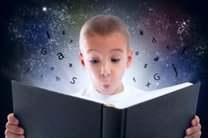 Boy discovering the magic of reading.